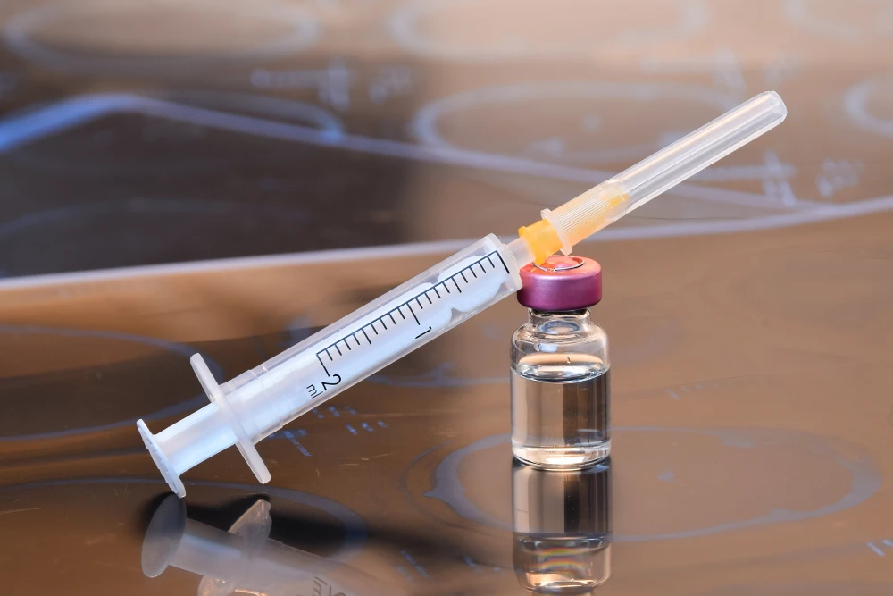 Botox syringe and vial for cosmetic treatments.