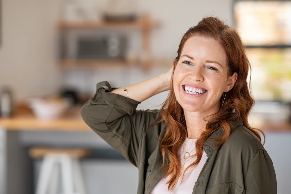 Happy woman enjoying life after BHRT treatment.