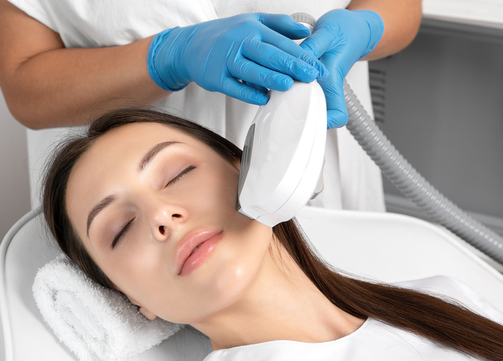 Elos epilation hair removal procedure on the face of a woman. Be