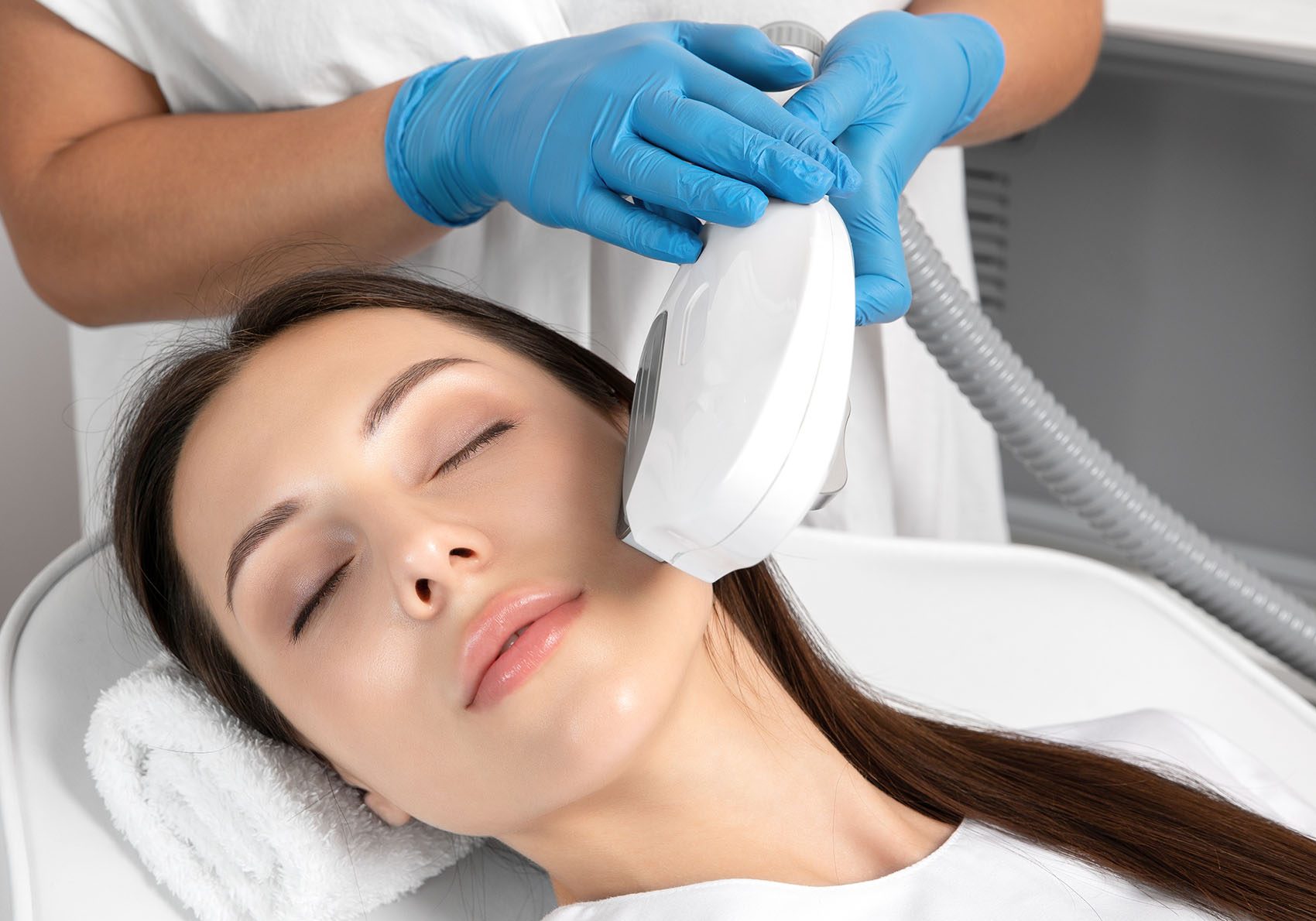 Elos epilation hair removal procedure on the face of a woman. Be
