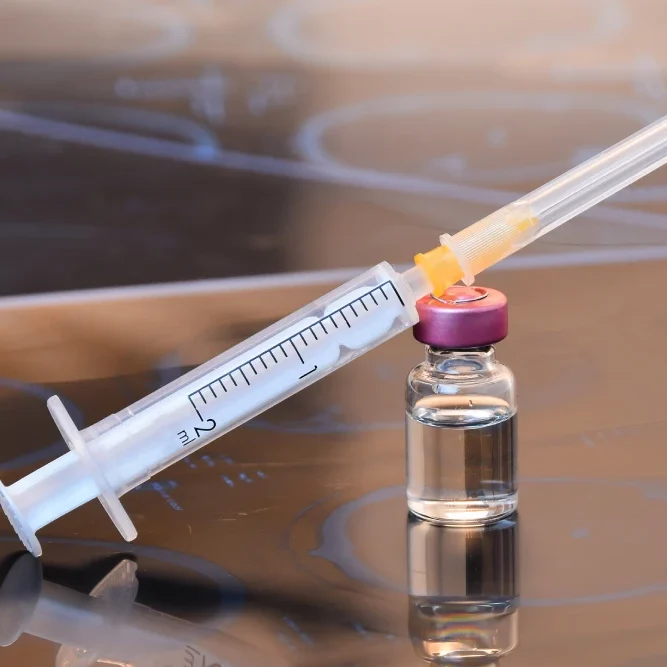 Botox Injection Preparation Botox syringe and vial for cosmetic treatments.